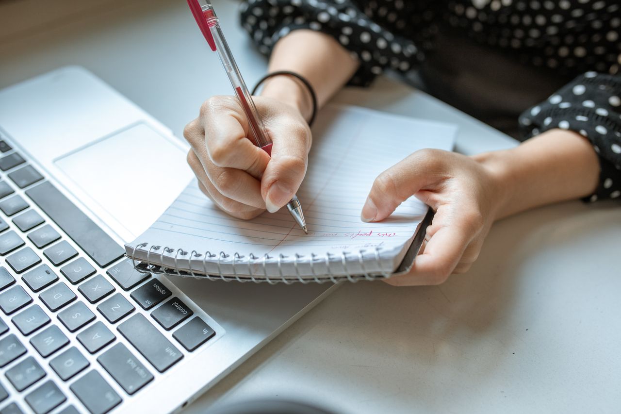 A salesperson planning the day's follow-up tasks