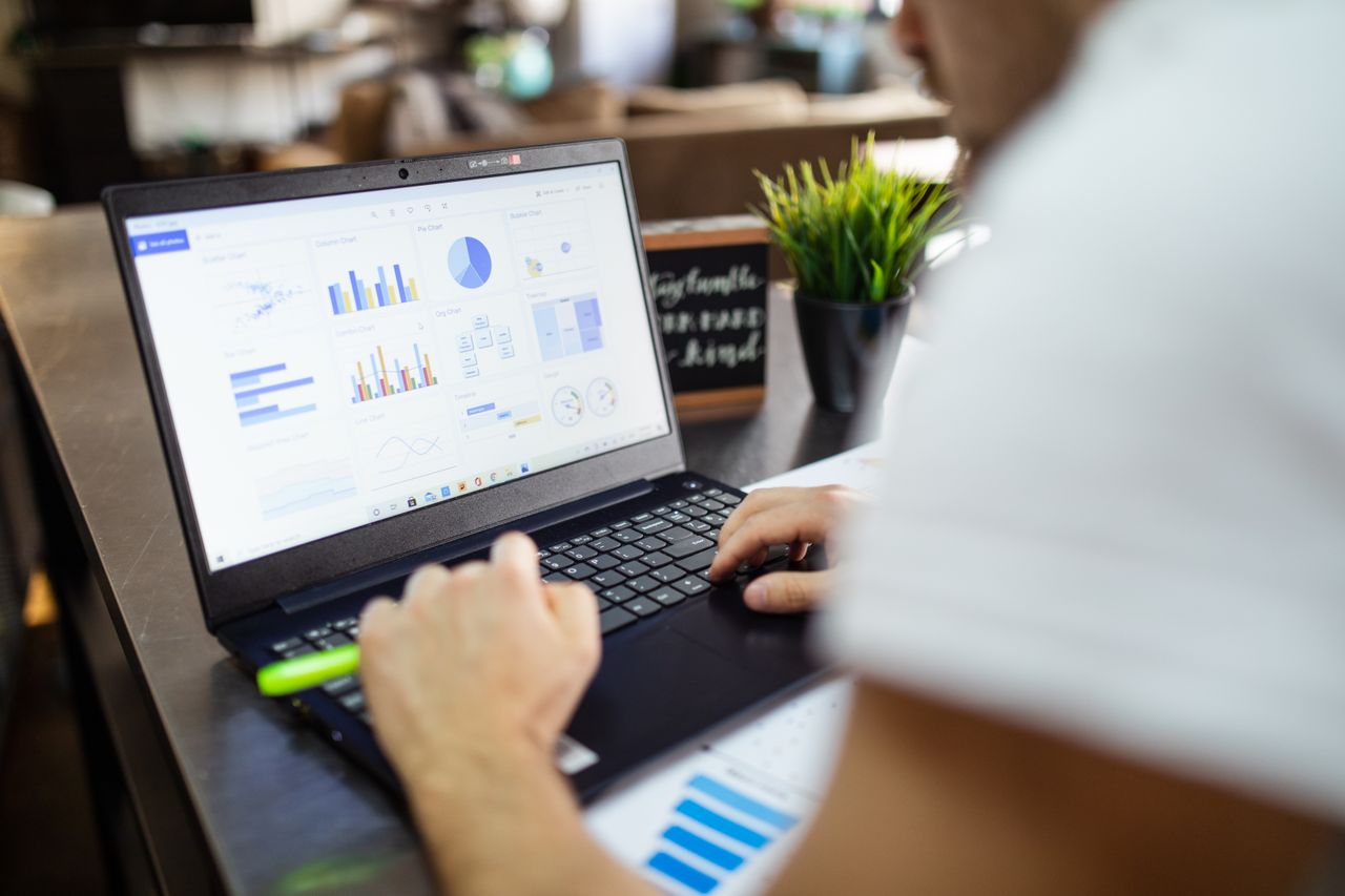 A spreadsheet of deals open on a laptop